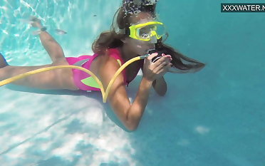 Cute teen Irina Poplavok swims undisguised submerged